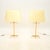 A large and impressive pair of vintage French acrylic glass and brass table lamps. They were recently imported from...