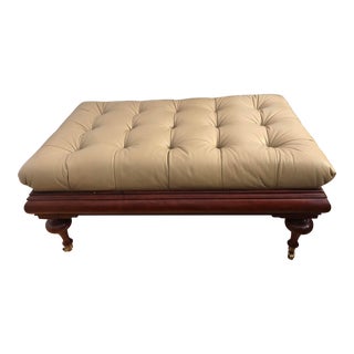 Traditional Tufted Leather Ottoman With Cherry Wood Trim on Wheels For Sale