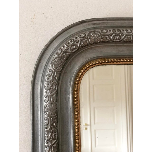 Antique French Louis Philippe mirror, dating to the late 19th century. The mirror features a grey-painted frame with a...