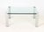 Italian Chrome and Glass Top Coffee Table. 16.25" H x 37.5" W x 37.25" D. Provenance: From the Estate of Gerard Stora,...