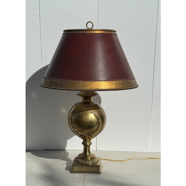 Large Neoclassical Gilt Bronze Table Lamp with Custom Ruby Red & Gold Shade hand gilded with hand beaded border. This...