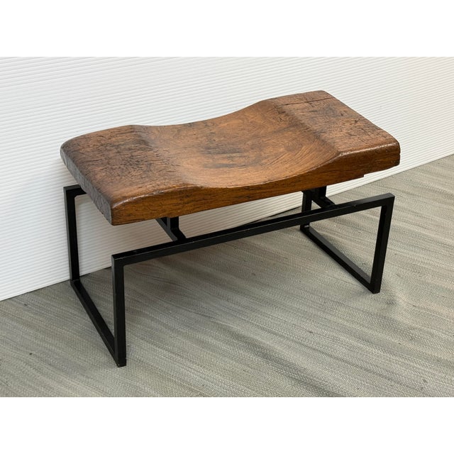 Design Plus Gallery presents a Contoured Seat with Live Edge Bench. The rustic bench has an organic feel with its natural...