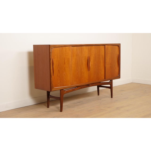 Insane highboard by designer Johannes Andersen for Danish manufacturer Silkeborg. This vintage cabinet is finished in a...