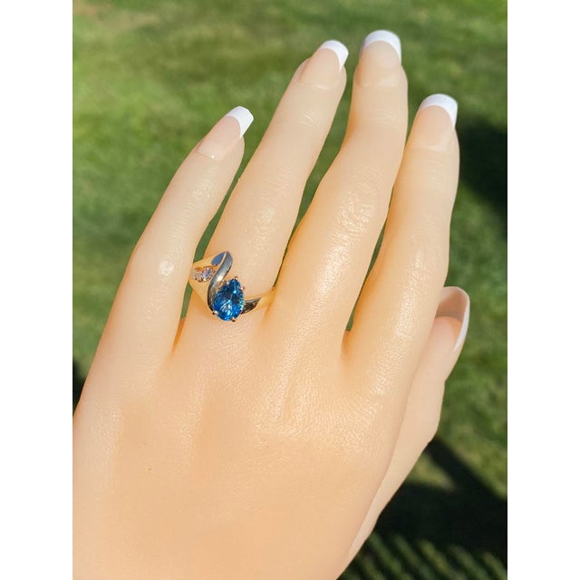 The Victiore: Ladies Mid Century Modern Topaz and Diamond Ring in 14K Gold. Crafted in 14 karat yellow gold, this ladies'...