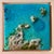 This artwork depicts a vibrant aerial view of the ocean, characterized by a rich palette of turquoise and deep blues,...