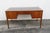 This high quality Desk is made of wood, solid wood, walnut, veneer, and leather. We believe it was made by United...