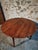This vintage round dining table originates from France and dates from around 1920. Crafted from solid cherrywood, the...