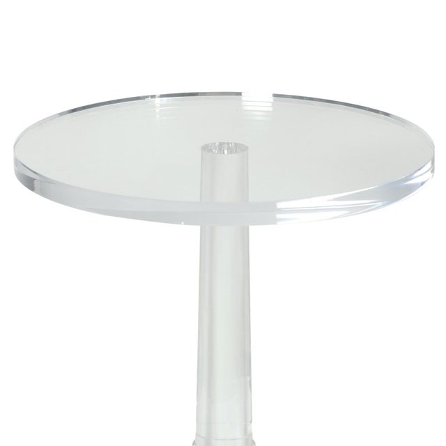 The Stowe Accent Table, crafted from acrylic, combines impeccable clarity with radiant shine. Its circular tabletop and...