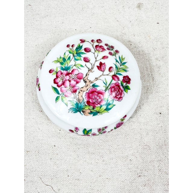 Vintage floral lidded box. Made by Limoges. Bright and colorful. Perfect to hold small jewelry or desk item. This is a...