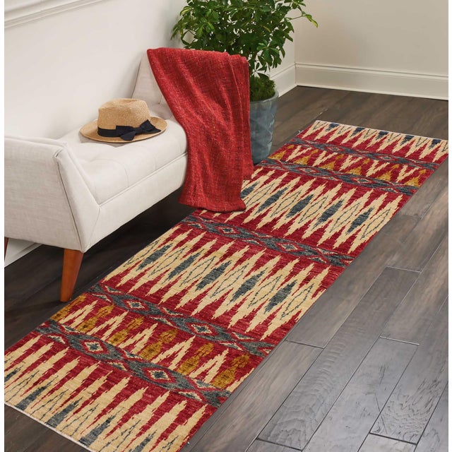 Add a splash of color with this dazzling transitional runner, hand-knotted in an all-over artful intricate pattern and a...