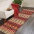 Add a splash of color with this dazzling transitional runner, hand-knotted in an all-over artful intricate pattern and a...