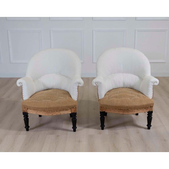 Charming pair of 19th century French chairs featuring classic proportions and enduring decorative appeal. The frames...