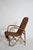 Rattan and wicker high back armchair, 1950s. Height: 96 cm - 37.8 in Length: 59 cm - 23.23 in Width: 70 cm - 27.56 in...