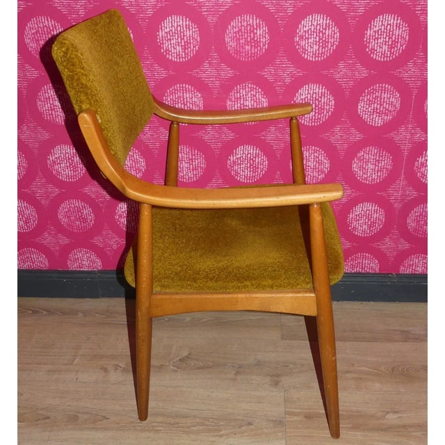 Particularly elegant, comfortable chair, 1960s comfortable padded seat and backrest. Finely shaped beech wood frame,...