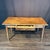 Handsome classic 19th century French Provincial table with a broad rectangular plank top, single central drawer with a...