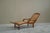 Sculptural Colonial Chaise Longue in Wood and Hand Woven Cane Webbing Early 20th Century An elegant Dutch Colonial chaise...