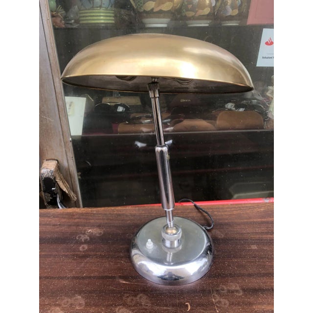 Elegant chrome ministerial lamp, designed by the Italian architect Giovanni Michelucci and made of chromed metal and brass...