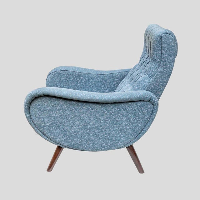 Pair of early 1950s Marco Zanuso Lady chairs, upholstered in light blue fabric with tapered brown wood legs over wrought...