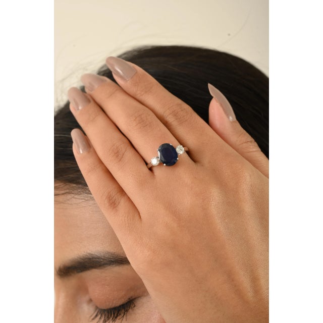 Elevate your jewelry collection with this breathtaking 14k white gold three-stone ring, showcasing a captivating...