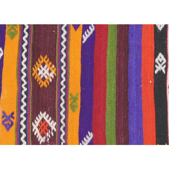 This vintage Turkish Kilim, measuring 3'6" x 5'7", is handwoven with wool on a wool foundation in Turkey's Oushak region....