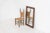 Sculptural graphic wall mirror (Sweden, 1960s). This wall mirror is made out of stained oak and offers a deeply carved...