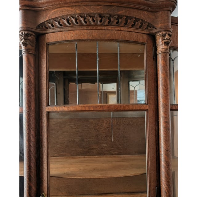 Antiques American Oak Curved Glass Cabinet. Has two glass shelves and two wooden shelves. The wood shelves have tracks for...