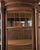 Antiques American Oak Curved Glass Cabinet. Has two glass shelves and two wooden shelves. The wood shelves have tracks for...