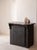 Small, dark, single-door sideboard with original dark patina. One shelf inside. Recovered in Spain, early 19th century.