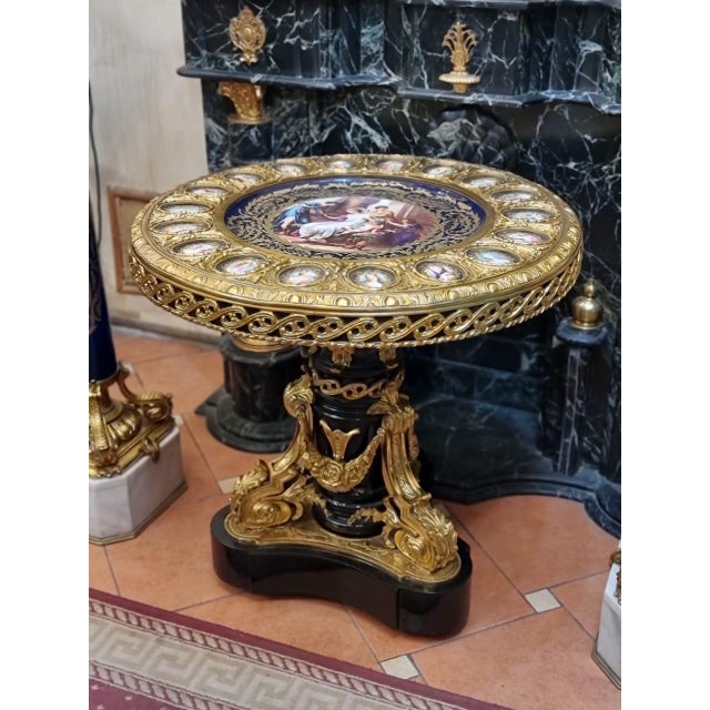 Description: This exquisite round table is a stunning example of fine European craftsmanship, likely dating from the 19th...