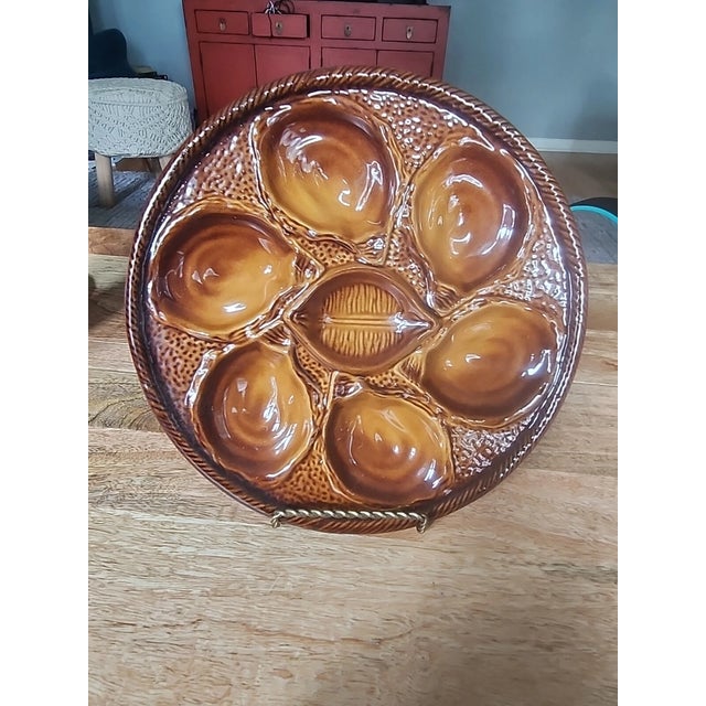 Beautiful vintage St. Clément Majolica oyster plate from France, crafted in richly glazed earthenware. This classic French...