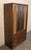Mid-century modern armoire style cabinet by Lane Furniture. This solid unit is made with walnut grain and accenting chrome...