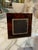 An elegant Italian photo frame crafted in richly mottled tortoiseshell Lucite, dating to the 1970s. The frame features a...