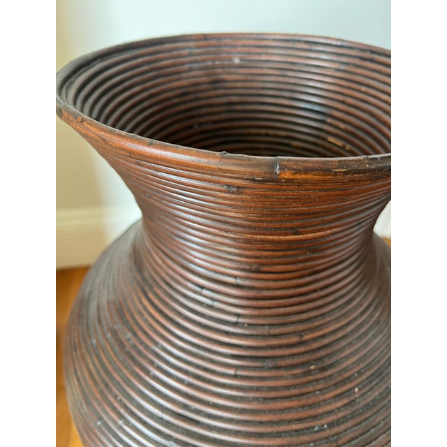 Incredibly pencil reed vase in the style of Gabriella Crespi. Measures 10” across the mouth, but the belly of the vase is...