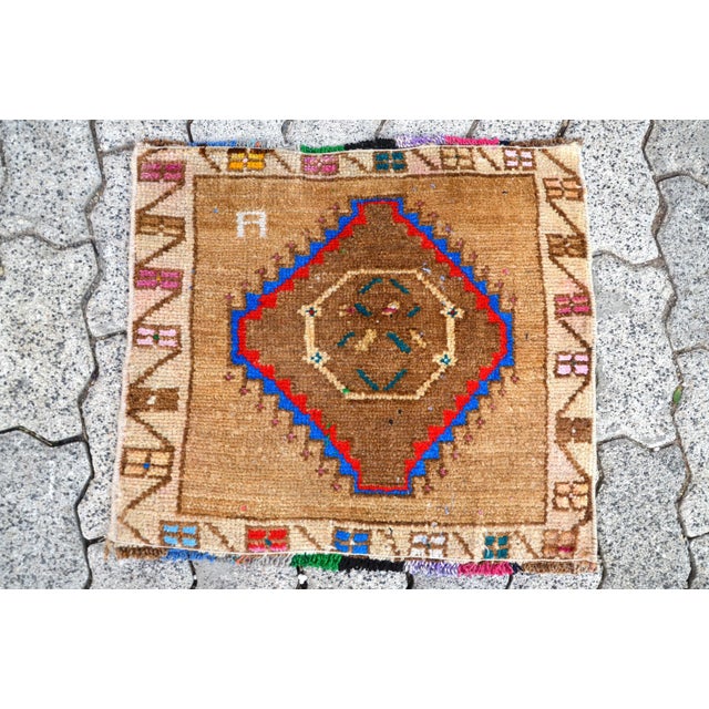 This is a vintage Turkish Oushak rug from the 1960s. The piece was hand-knotted.