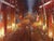 The painting captures a vibrant cityscape at night, showcasing the bustling energy of Denver as seen from the pavilion....