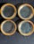 A set of four Annieglass “Roman Antique” appetizer plates, each hand-formed glass with a 24k gold rim. Most examples are...
