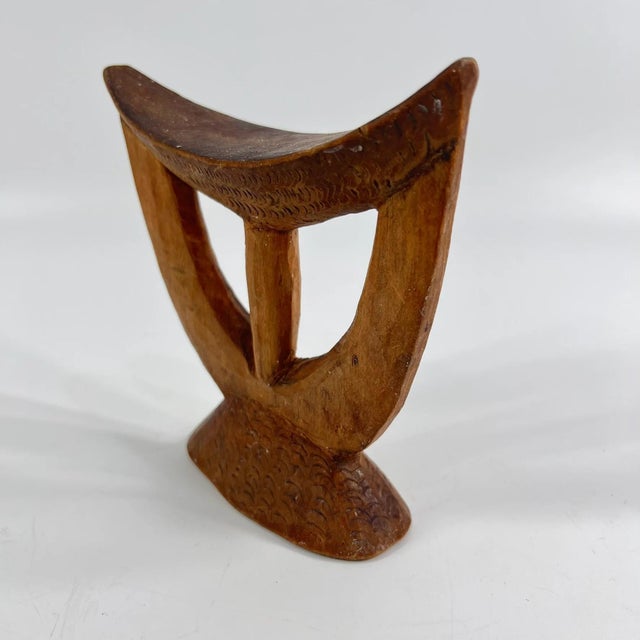 Ethiopian headrests come in various forms. They range from simple to elaborately carved artifacts. They have abstract...