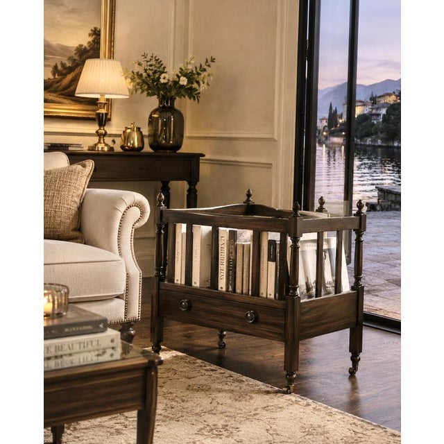 Vintage danish canterbury executed in dark stained wood with an integrated drawer and turned details. the open...