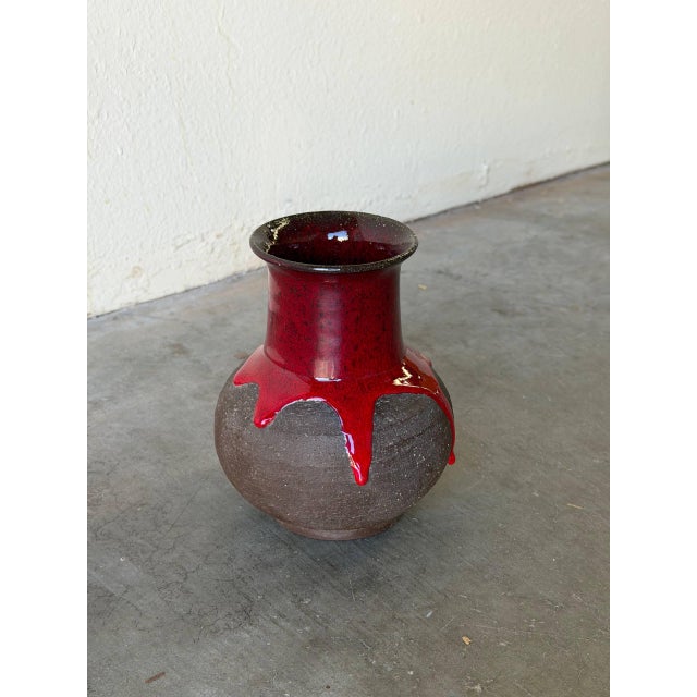 Striking set of two vintage Danish ceramic vases by Lehmann, featuring dramatic red lava glaze over a textured dark...