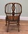 A handsome pair of Windsor armchairs with tall bowed backs and slender spindles The shaped central splats feature pierced...