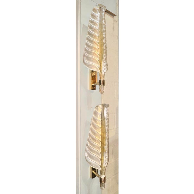 These Murano glass sconces are exquisitely crafted in the shape of leaves, adding a touch of elegance and charm to any...