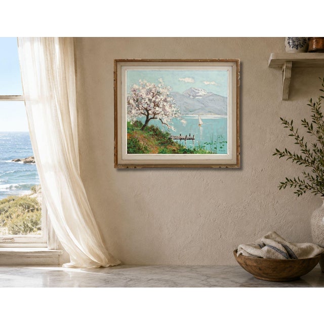 Mid 20th century French oil on board painting depicting a serene lakeside landscape with flowering tree, distant...