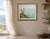 Mid 20th century French oil on board painting depicting a serene lakeside landscape with flowering tree, distant...