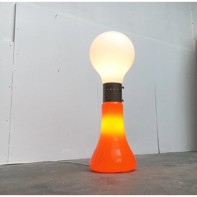 Impressive Space Age floor lamp made in Italy with two different colored glass bodies. This rare lamp impresses with its...