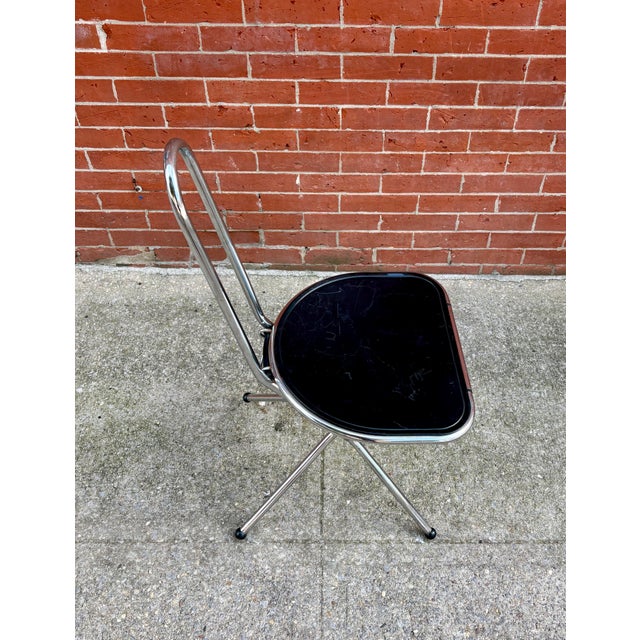 Designed by Danish architect and designer Niels Gammelgaard for IKEA in the 1970s, this set of folding chairs captures the...
