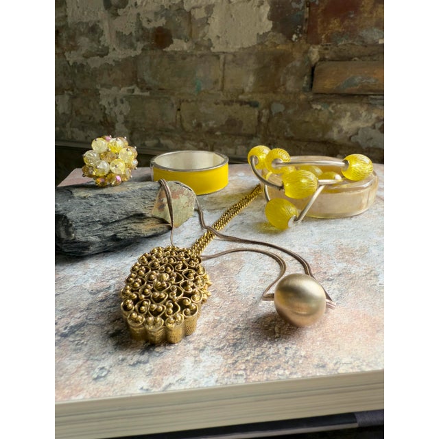 Vintage early 2000s yellow enamel hinged bangle bracelet in the style of Hermes. The wide band is finished in glossy...