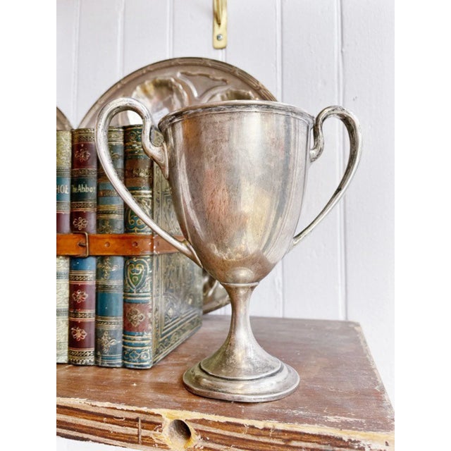 A beautiful antique circa 1913 solid sterling silver trophy cup with engraved on the front to read: Morristown Field Club...