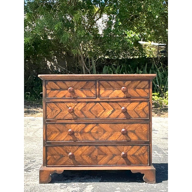This exquisite vintage herringbone chest of drawers is a perfect blend of bohemian charm and classic craftsmanship. The...