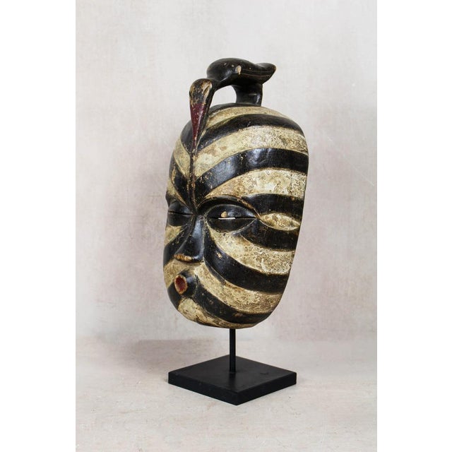 The Songye mask is an extraordinary and culturally significant art piece originating from the Songye people of the...