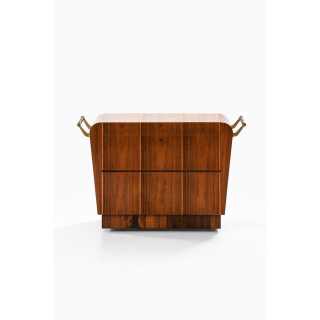 This very rare bar trolley, designed by erik matsson and produced by mjölby intarsia in sweden during the 1930s,...